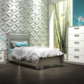 Bedroom with white detailed wall, blue wall and dark floors, with a grey twin bed, nightstand and 5 drawer dresser with white drawer facades