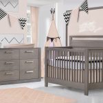 Pink baby room with pink rug, a pink teepee and grigio wooden convertible crib and double dresser, featuring a soft pink matty changing table