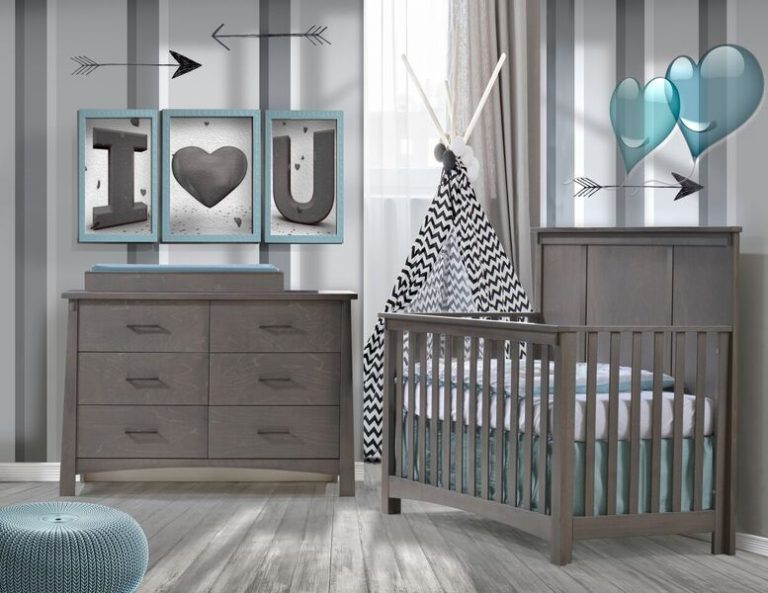 baby room with grey and white striped walls with blue hearts and framed letters with wooden floors, dark wood double dresser and crib with blue sheets, a blue ottoman