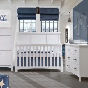 white and blue baby nursery with framed JOY on wall and outline of city on the wall. With white double dresser, 5 drawer dresser and crib with grey matty changer