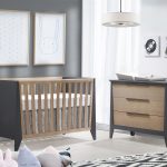 grey and white nursery with graphite and natural oak wood crib and 3 drawer dresser